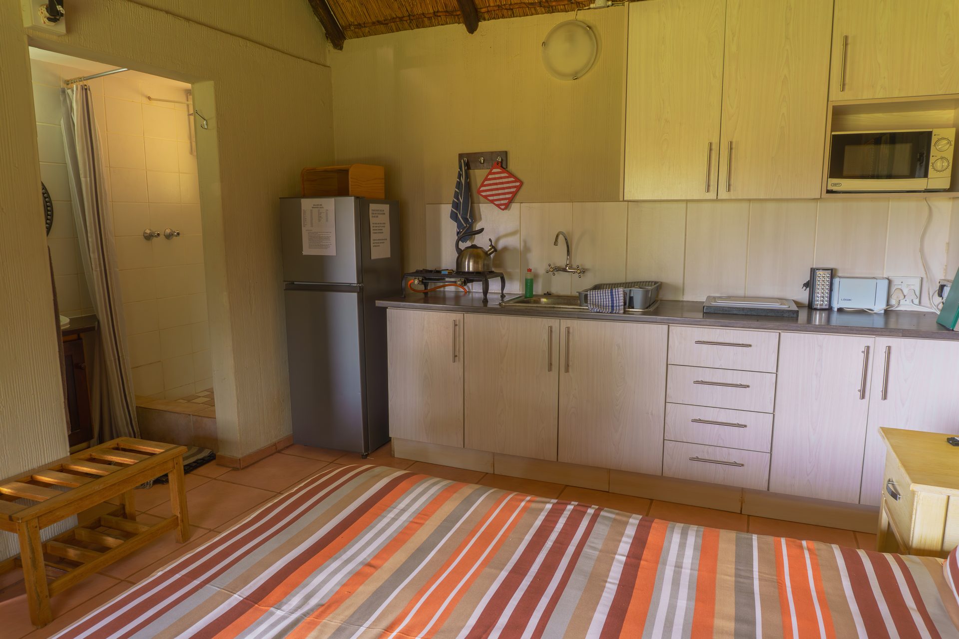 Kitchen in 4-sleeper self-catering chalet at Gallery Inn Bela Bela