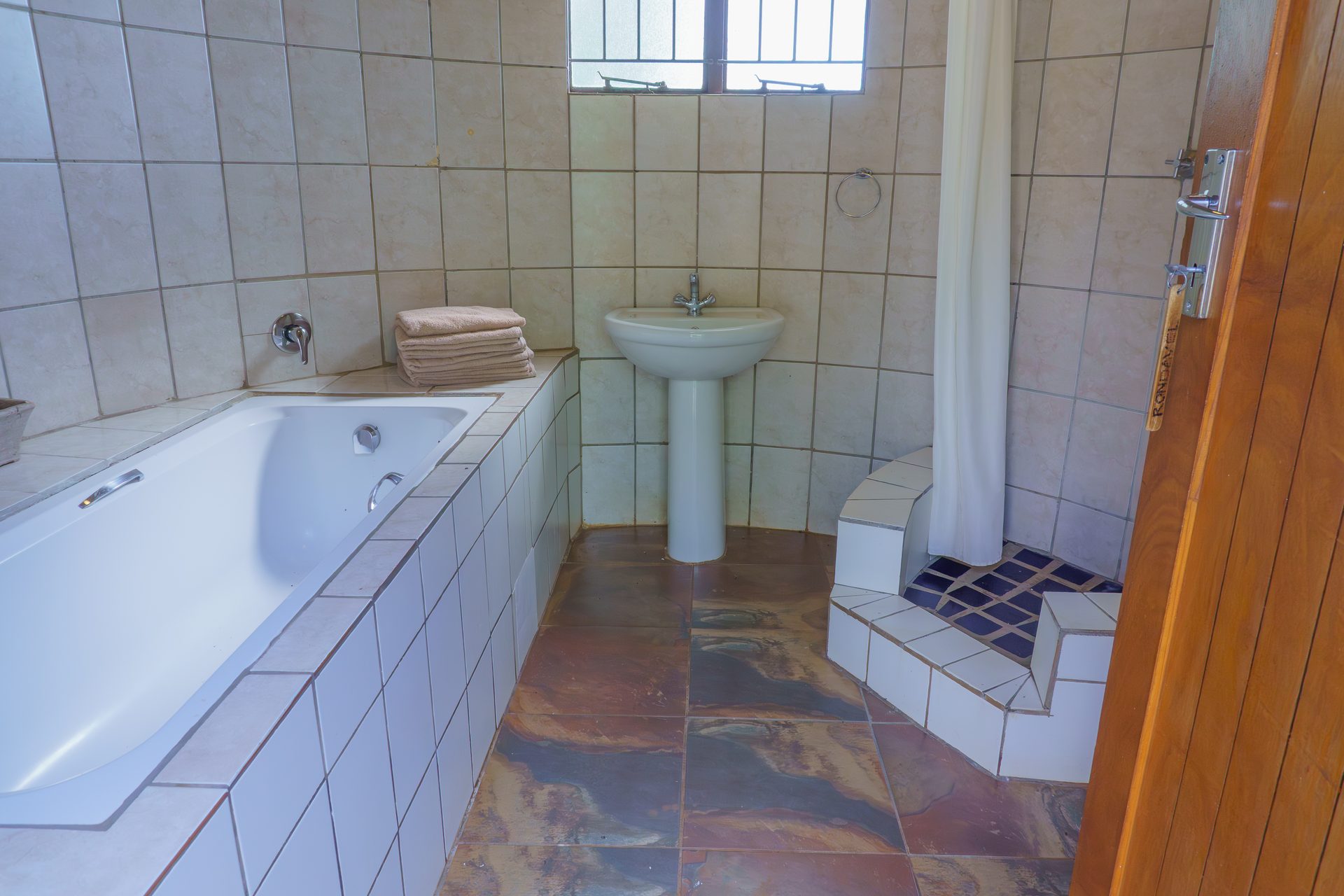 Bathroom in 8-sleeper group chalet at Gallery Inn Bela Bela