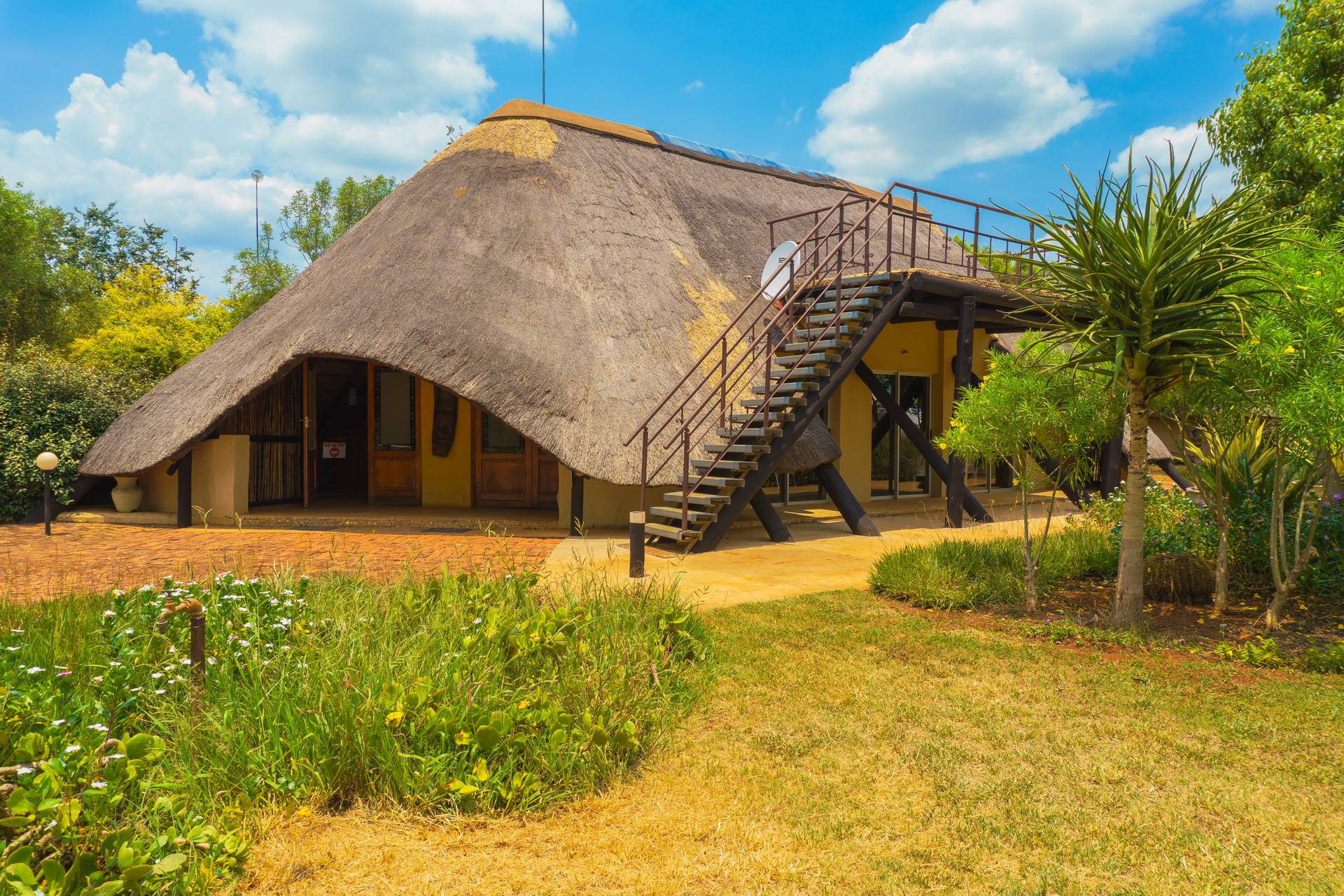 Thatched farmstyle chalets at Gallery Inn Bela Bela